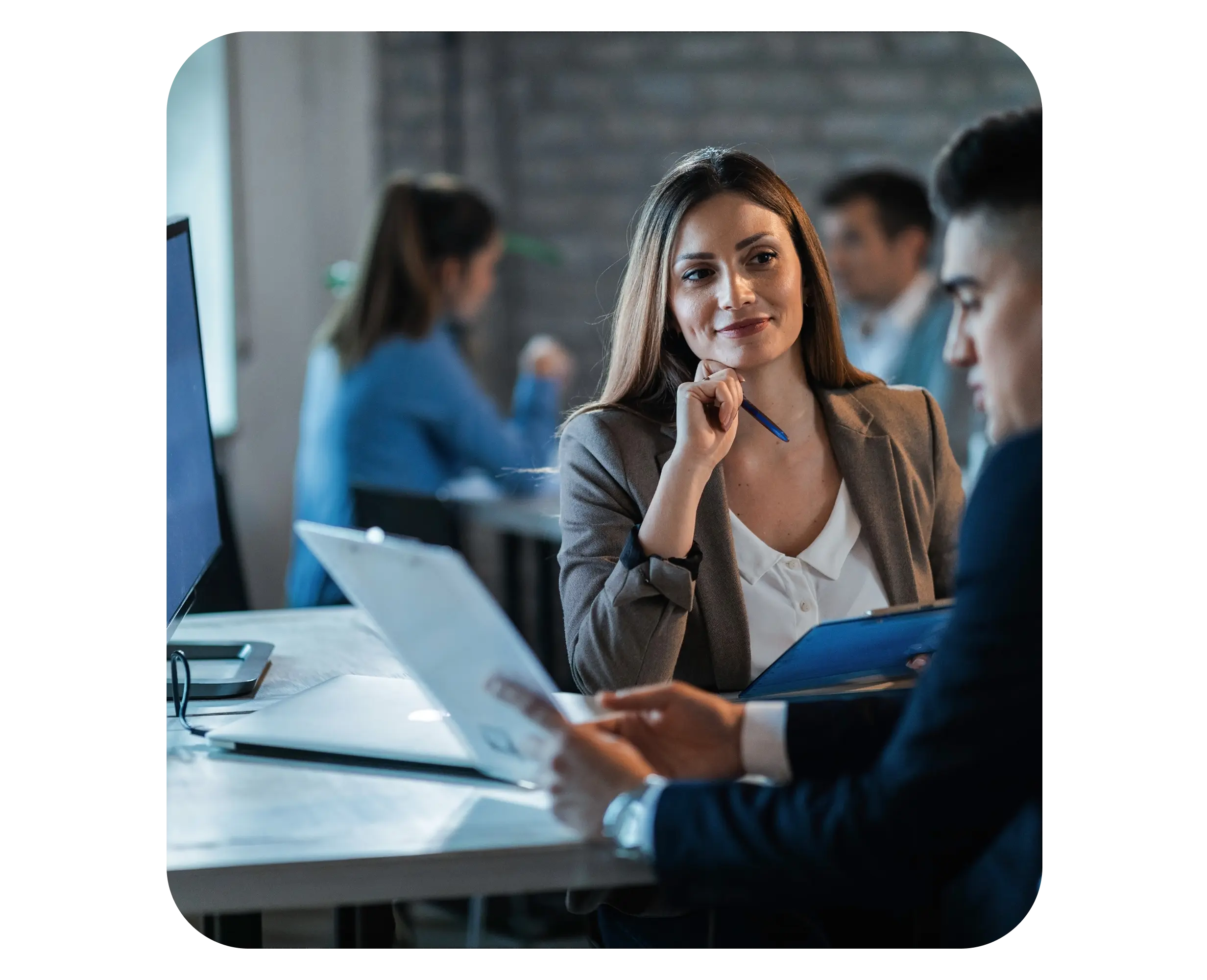 Business consultant reviewing documents with a client for company registration in Serbia