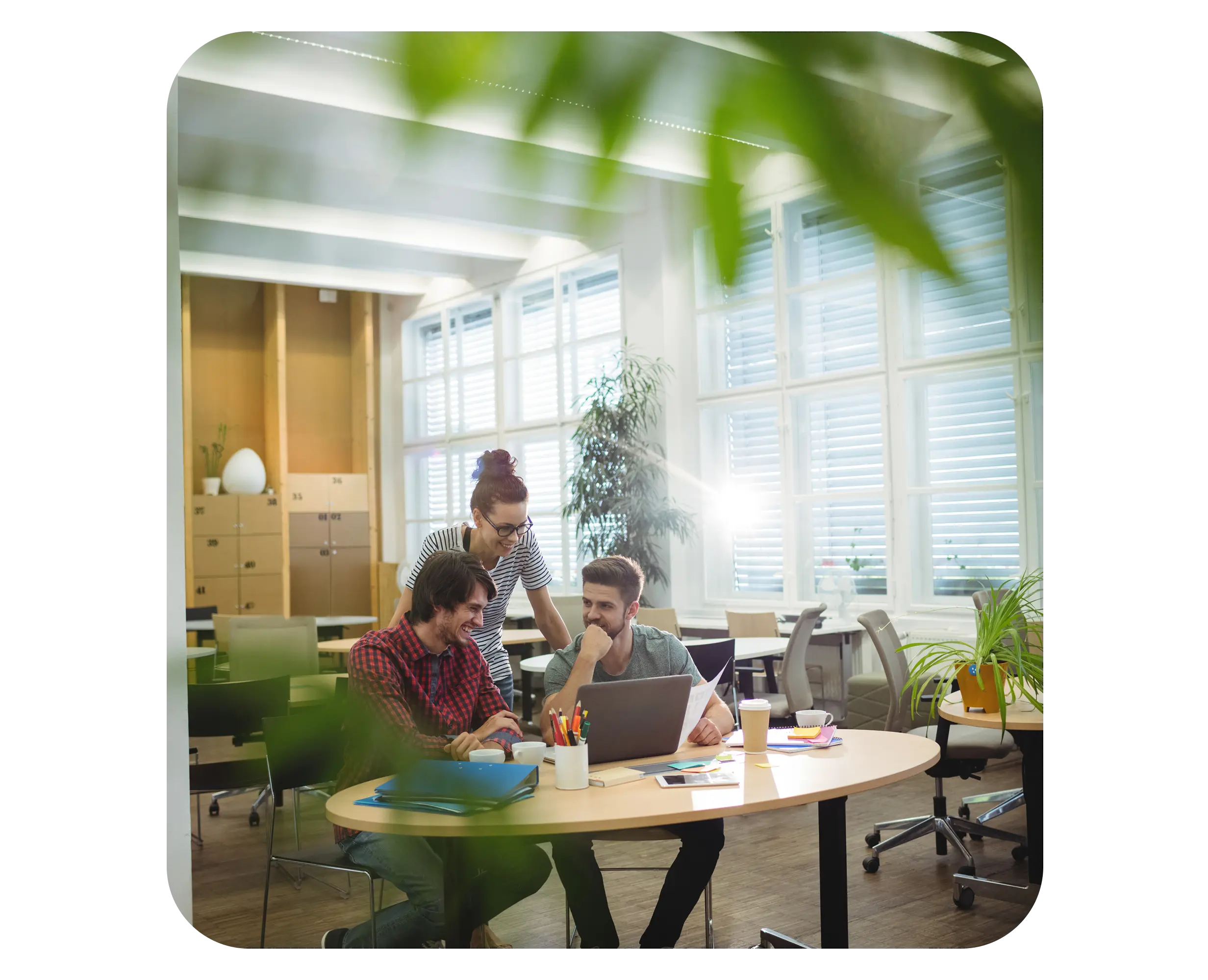 Young entrepreneurs collaborating in a bright coworking space while setting up a business in Serbia