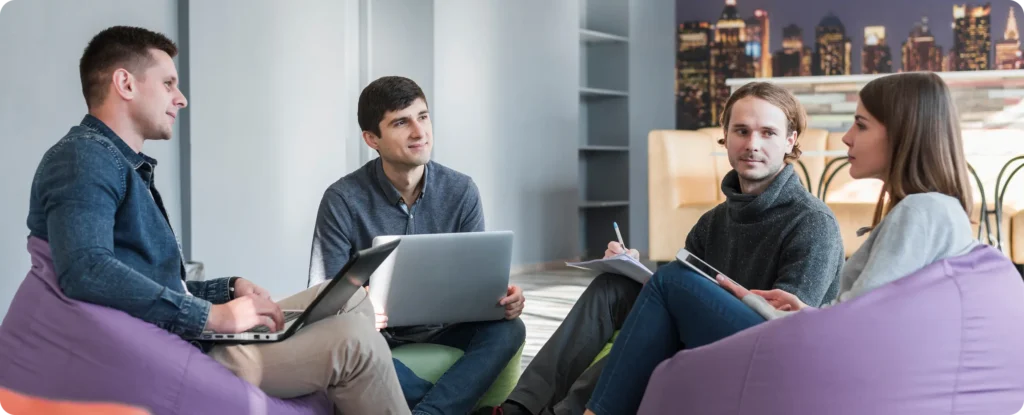 Startup team collaborating in a modern coworking space to set up and run a business in Serbia
