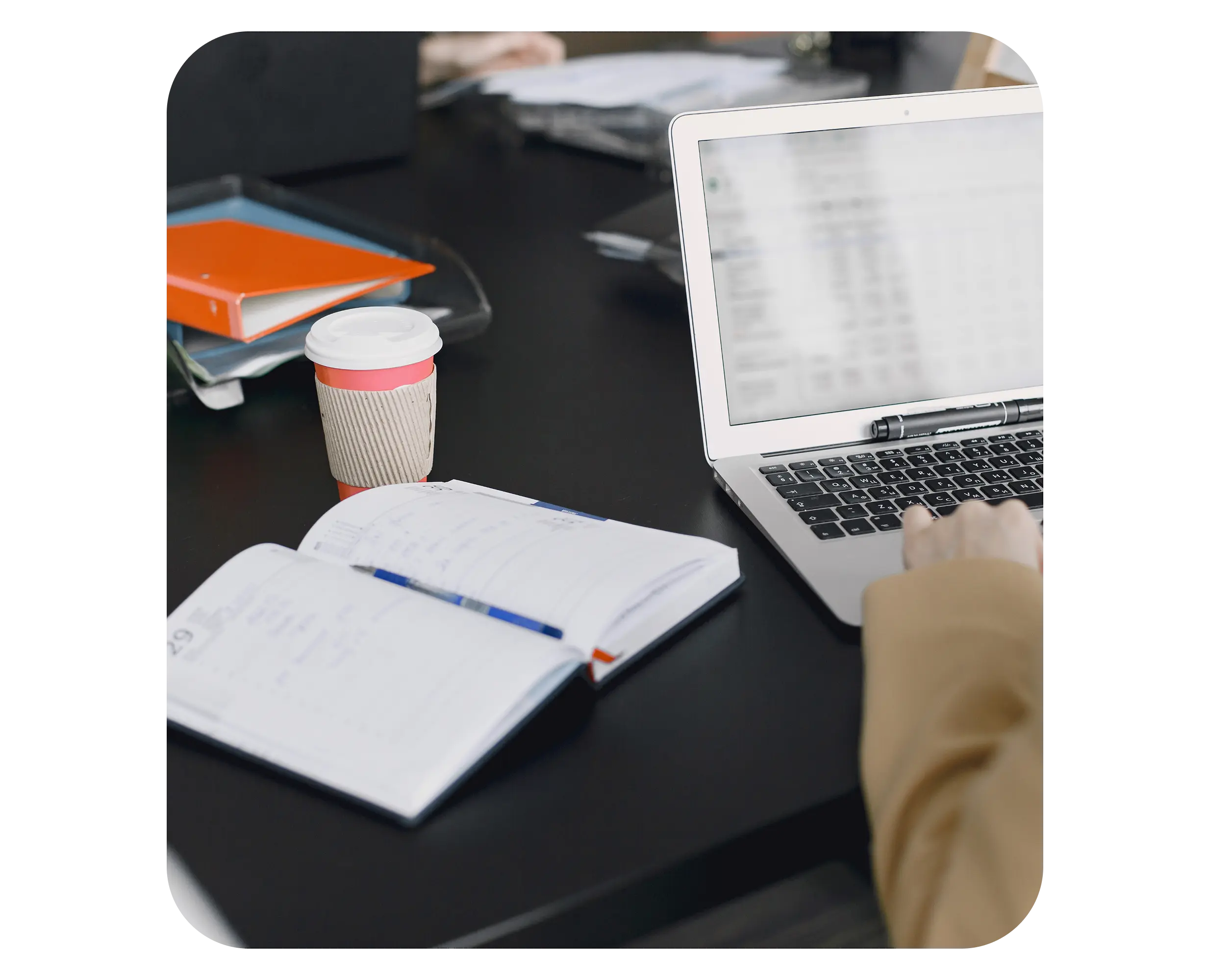 Laptop and business documents on a desk for company registration and tax compliance in Serbia